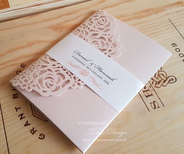 Pocket invitations in blush pink  and laser with rose design