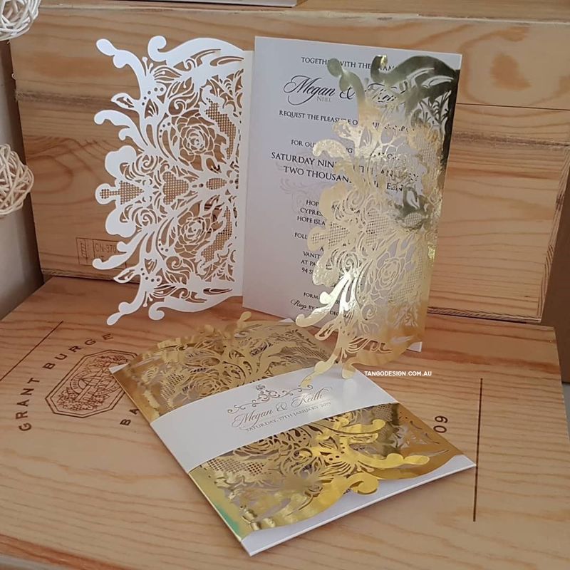 Laser cut wedding invitation printed in Australia. Invites made with gold foil mirror paper and pearlescent card