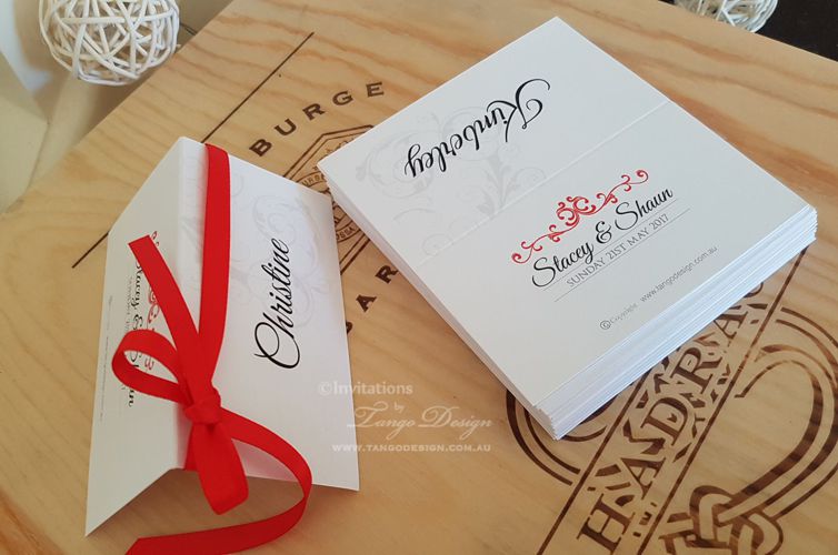 seating card wedding or event, name table cards red ribbon and guest names dinner